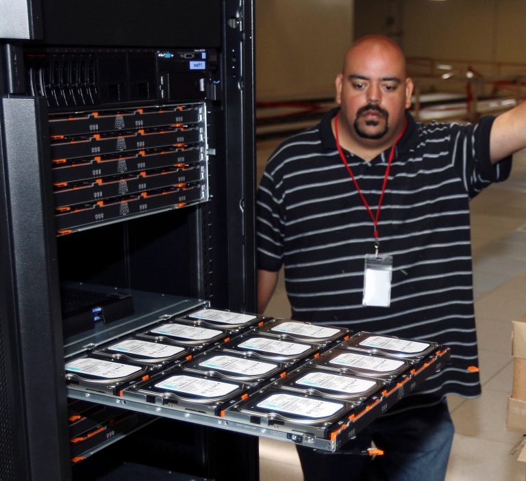   David Barela looks over a dozen disk drives that holds up to 15 peta bytes or 15,000 terabytes of information Thursday June 7, 2012 at NCAR-Wyoming Supercomputing Center in Cheyenne, Wyo. (AP Photo/Laramie Boomerang, Andy Carpenan)  