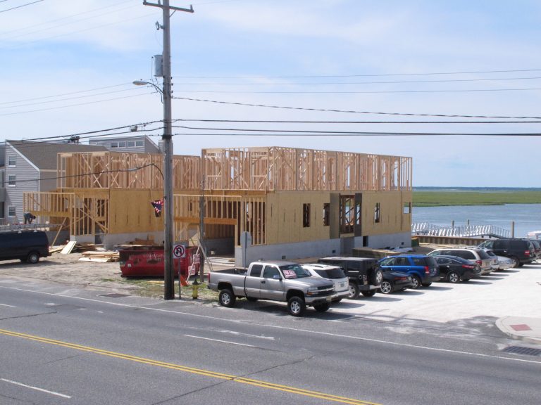 This June 23, 2014 photo shows two buildings under construction on the edge of a waterway in Brigantine, N.J. In its first major rewrite of coastal protection rules since Superstorm Sandy, New Jersey is proposing changes that would make it easier for some new or expanded development along the Jersey shore and the state's urban waterways. (AP Photo/Wayne Parry)