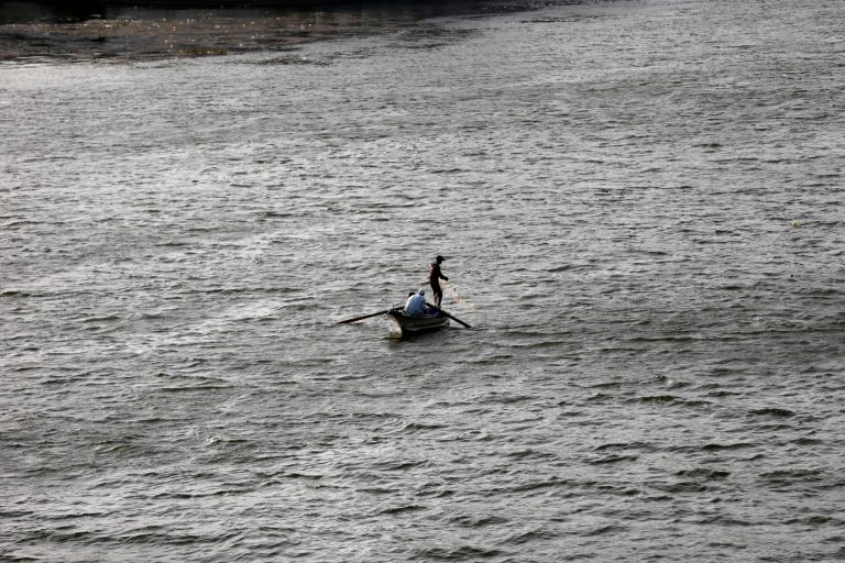 An Egyptian fishes with a net in the Nile River, in Cairo, Egypt, Wednesday, June 5, 2013. Egyptian officials tried to cool tensions with Ethiopia Wednesday over the new Nile River dam project by highlighting its 