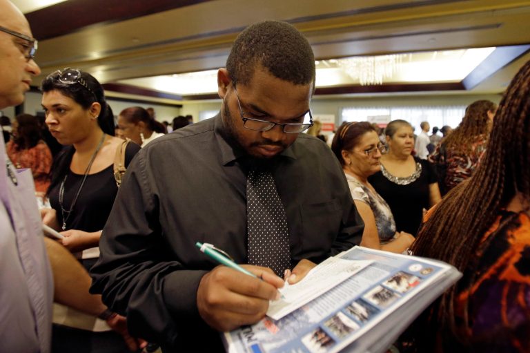   In this Wednesday, Aug., 14, 2013, photo, job seeker Kelsey Devoe, of Miramar, Fla., fills out a contact form at a job fair in Miami Lakes, Fla. The Labor Department reports on the number of Americans who applied for unemployment benefits last week on Thursday, Aug. 15, 2013. (AP Photo/Alan Diaz)  