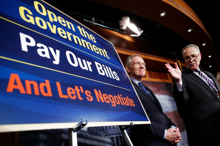 Senate Majority Leader Harry Reid of Nevada, left, and Sen. Chuck Schumer, D-N.Y., speak to reporters about their meeting with Senate Republicans regarding the government shutdown and debt ceiling on Capitol Hill in Washington, Saturday, Oct. 12, 2013. (AP Photo/Charles Dharapak)