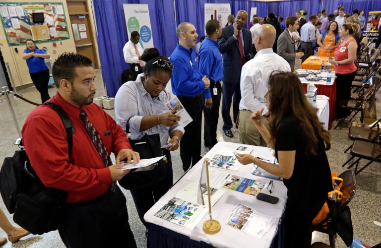 Job seekers check out the job opportunities at a Hiring Fair in Fort Lauderdale, Fla. (AP/Alan Diaz)