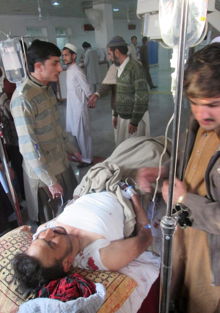 A Pakistani man, who was injured in a bomb blast in Kohat, receives treatment at a hospital in Peshawar, Pakistan, Sunday, Feb. 23, 2014.  A bomb planted at a busy bus terminal near a police station in northwest Pakistan exploded Sunday, killing several people and wounding many near the country's lawless tribal region, authorities said. The explosion targeted passengers in a motorized rickshaw and those on a mini-bus in Kohat, some 150 kilometers (100 miles) west of the capital, Islamabad, police official Iqbal Khan said. (AP Photo/Mohammed Zubair)