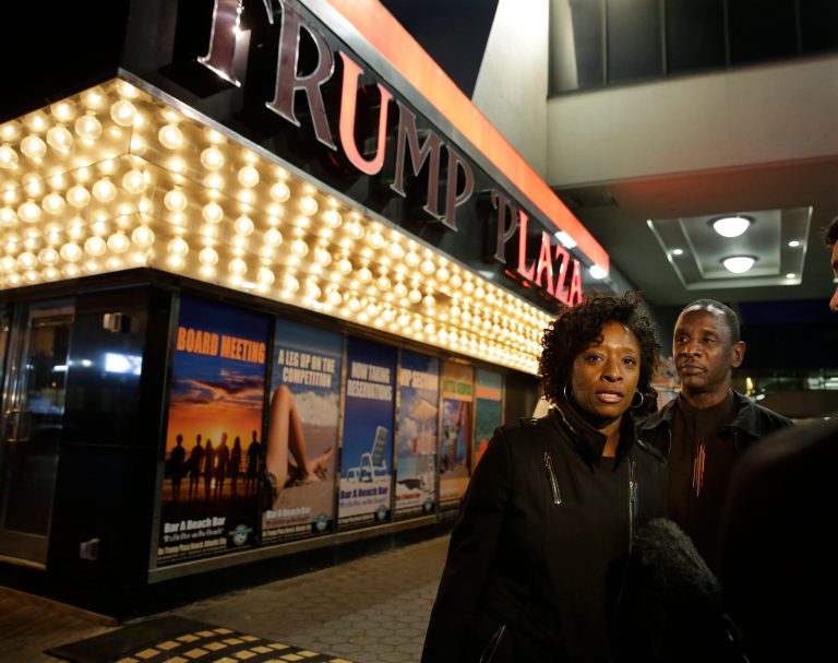 Ruth Hardrick, a dealer who worked at Trump Plaza Hotel & Casino for 26 years, stands with friend, Anthony Powell, on The Boardwalk, as she answers a question after the casino closed early Tuesday, Sept. 16, 2014, in Atlantic City, N.J. Trump Plaza is the fourth Atlantic City casino to go belly-up so far this year. (AP Photo/Mel Evans)