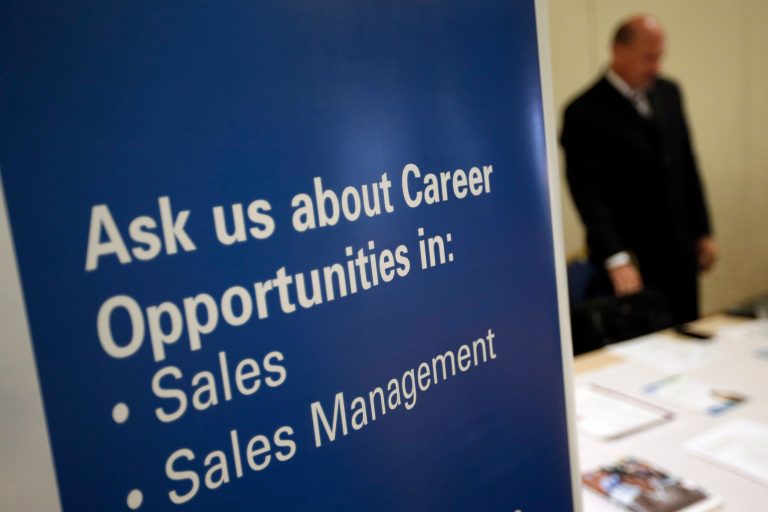 A recruiter waits to meet with job seekers at a career fair in King of Prussia, Pa., on June 24. (AP Photo/Matt Slocum)