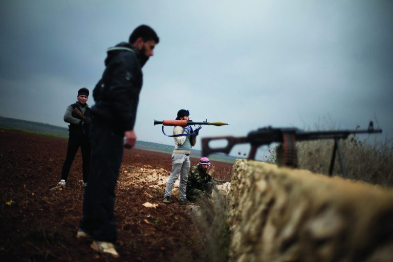 Free Syrian Army fighters take their positions, close to a military base, near Azaz, Syria, Monday, Dec. 10, 2012. The gains by rebel forces came as the European Union denounced the Syrian conflict, which activists say has killed more than 40,000 people. (AP Photo/Manu Brabo)