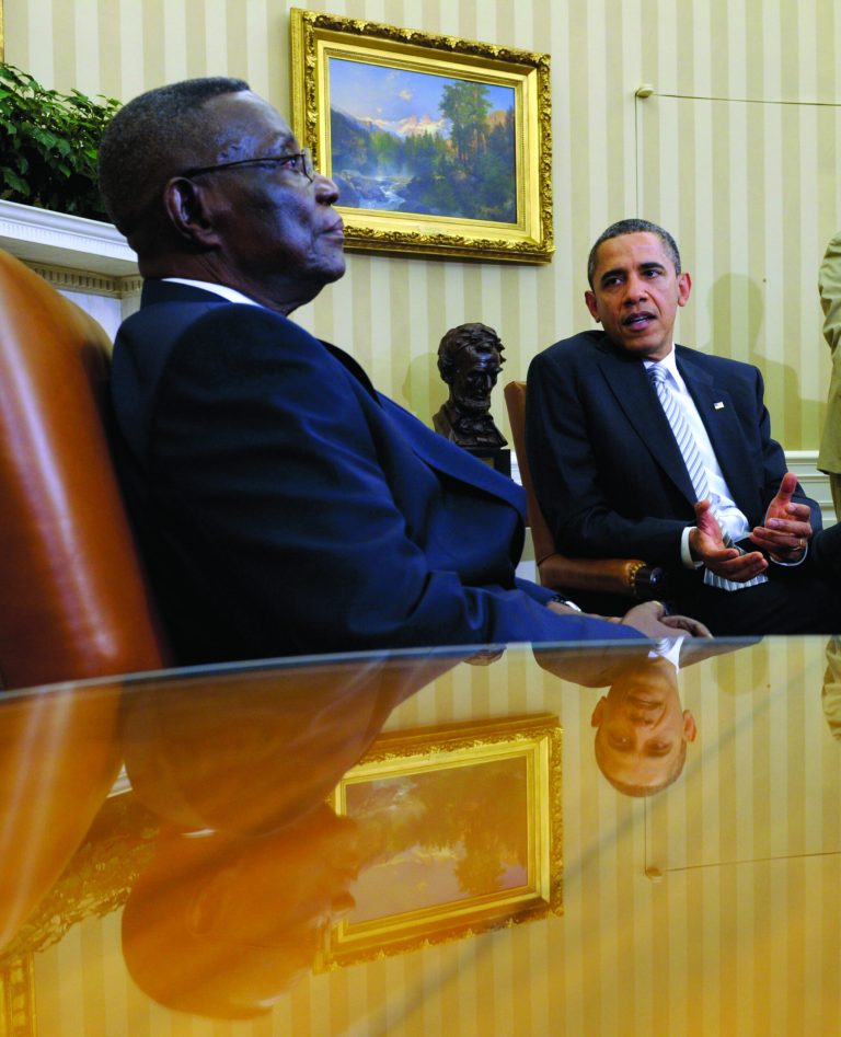 File - in this file photo taken on Thursday, March, 8, 2012, President Barack Obama, right, speaks as President John Evans Atta Mills of Ghana, left, listens during their meeting in the Oval Office of the White House in Washington. State-run television in Ghana is announcing on Tuesday, July 24, 2012, that President John Atta Mills has died at age 68. (AP Photo/Susan Walsh, file)