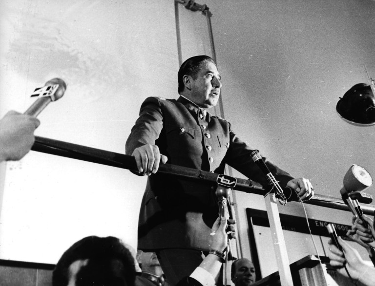 FILE - In this 1974 file photo, Chilean dictator Gen. Augusto Pinochet speaks at an informal press conference in Santiago, Chile. Newly declassified U.S. documents indicate that Pinochet planned to use violence to annul the referendum that ended his brutal regime in 1988. The formerly secret documents posted by the independent U.S. National Security Archive on Friday, Feb. 22, 2013 showed U.S. officials warning Chilean leaders against violence if Pinochet tried to use force to stay in power if people voted against eight more years of his rule. They also show U.S. officials and agencies backed the anti-Pinochet campaign portrayed in the Oscar-nominated film 