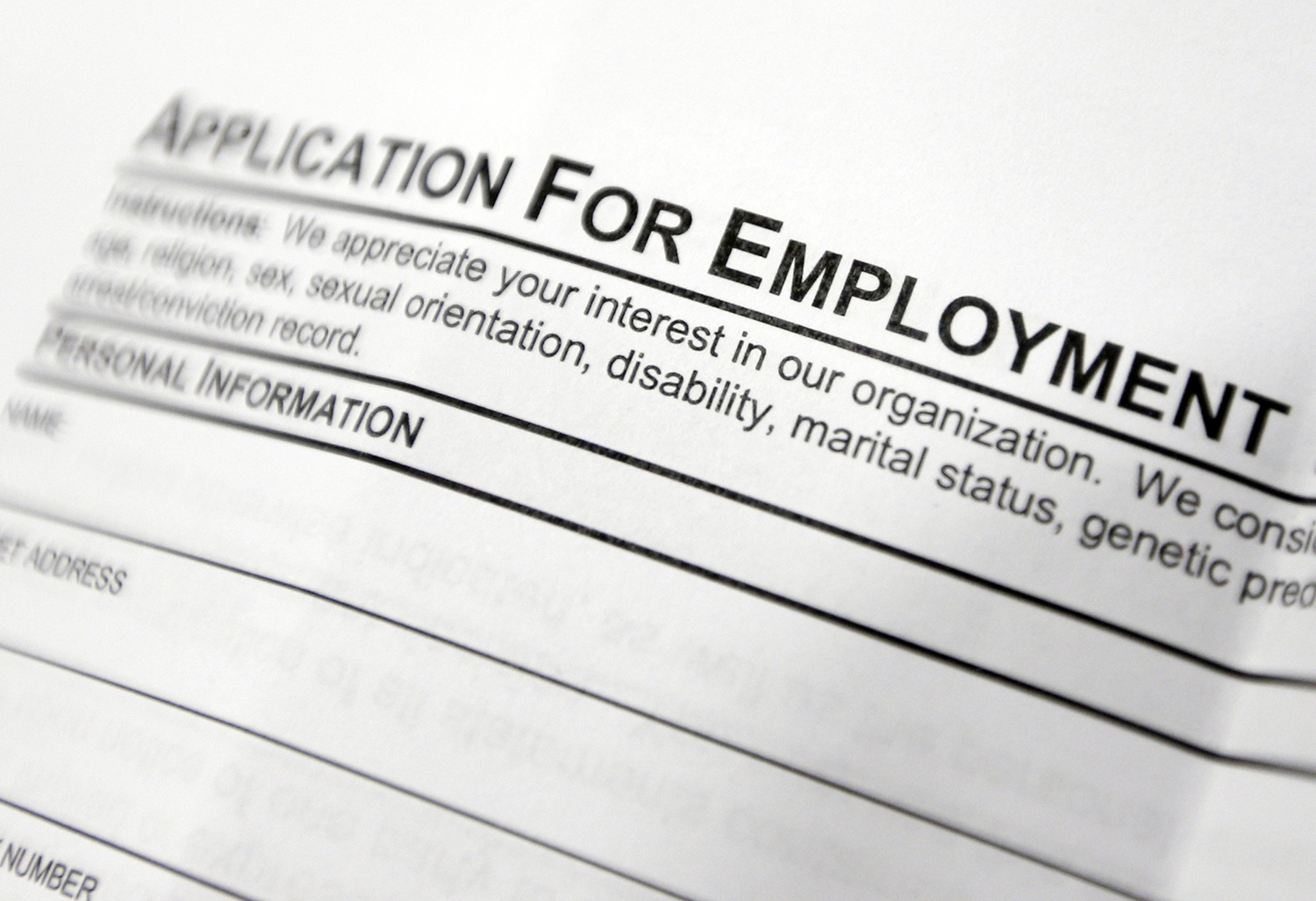 Jobless claims edge up from four-decade low to 243,000