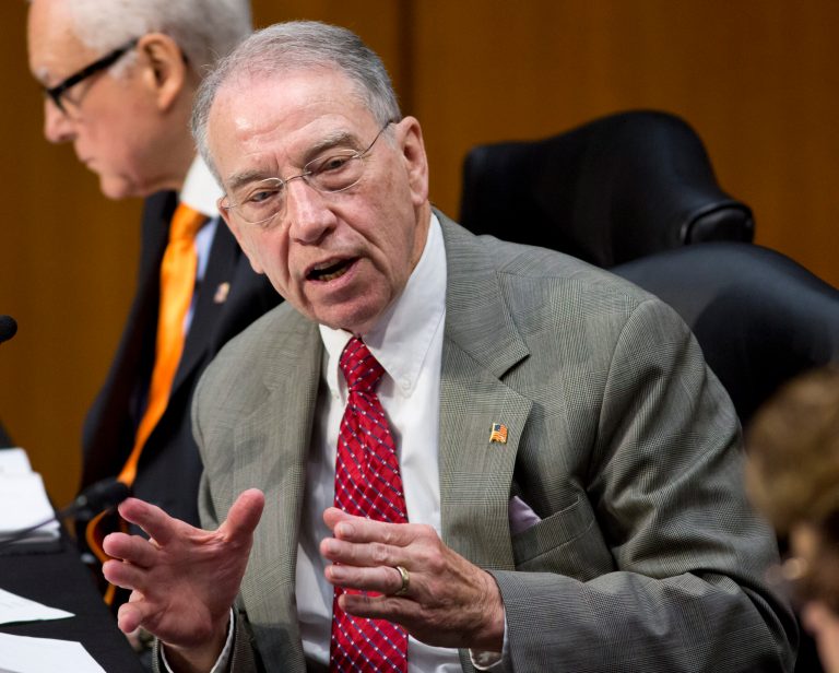   FILE - In his May 9, 2013 file photo, Sen. Charles Grassley, R-Iowa speaks on Capitol Hill in Washington. The Obama administration has tossed back in the lap of Congress a prickly political question involving health insurance for staffers and lawmakers themselves. Proposed regulations issued Wednesday say lawmakers' offices should individually decide whether staffers are subject to a health law provision that would require them to switch their insurance from the federal plan to new coverage coming next year under President Barack Obama's overhaul. The rules do clarify that the government will continue to pay its standard share of premiums, resolving one of the biggest unknowns about the health law provision, which was authored by Grassley. (AP Photo/J. Scott Applewhite, File)  