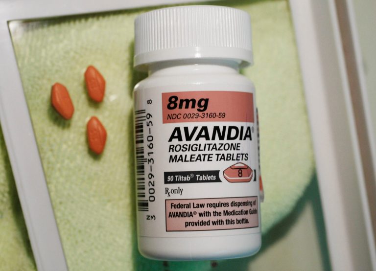 FILE - In this file photo made June 30, 2010 three Avandia pills are displayed near the bottle in Palo Alto, Calif. The Food and Drug Administration said Monday, Nov. 25, 2013, it is lifting severe safety restrictions on the former blockbuster diabetes pill Avandia, citing recent data suggesting that the much-debated medication does not increase the risk of heart attack. (AP Photo/Paul Sakuma, File)