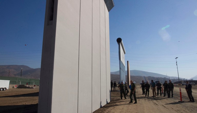 Tommy Fisher's company was one of six chosen to build the four concrete and four nonconrete wall prototypes in San Diego last fall. The barriers are being tested and evaluated by Department of Homeland Security agencies. (John Gibbins/The San Diego Union-Tribune via AP, Pool)
