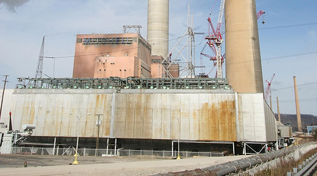Smoke surrounds smokestacks at American Electric Power's Kammer-Mitchell plant south of Moundsville, W.Va., about 68 miles southwest of Pittsburgh, Pa., Sunday, March 5, 2006.