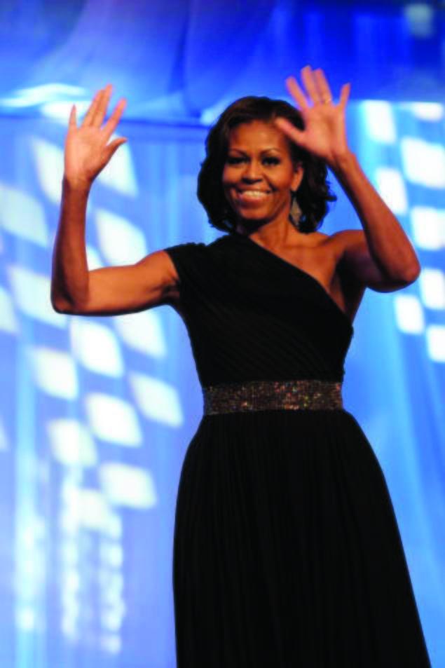 First lady Michelle Obama is introduced onstage to address the Congressional Black Caucus Foundation's 42nd Annual Phoenix Awards dinner last weekend where she urged African Americans to get out the vote. Cliff Owen/AP Photo