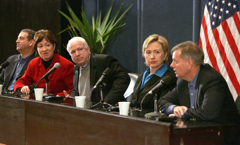 From left, Sen. Russell Feingold, D-Wis., Sen. Susan Collins, R-Maine, Sen. John McCain, R-Ariz., Sen. Hillary Clinton, D-N.Y., and Sen. Lindsey Graham, R-S.C., sit together during a press briefing in the Green Zone February 19, 2004 in Baghdad, Iraq. They were part of a United States Congressional delegation who visited Iraq and met with the country's interim government leaders and U.S. soldiers. (Photo by Joe Raedle/Getty Images)