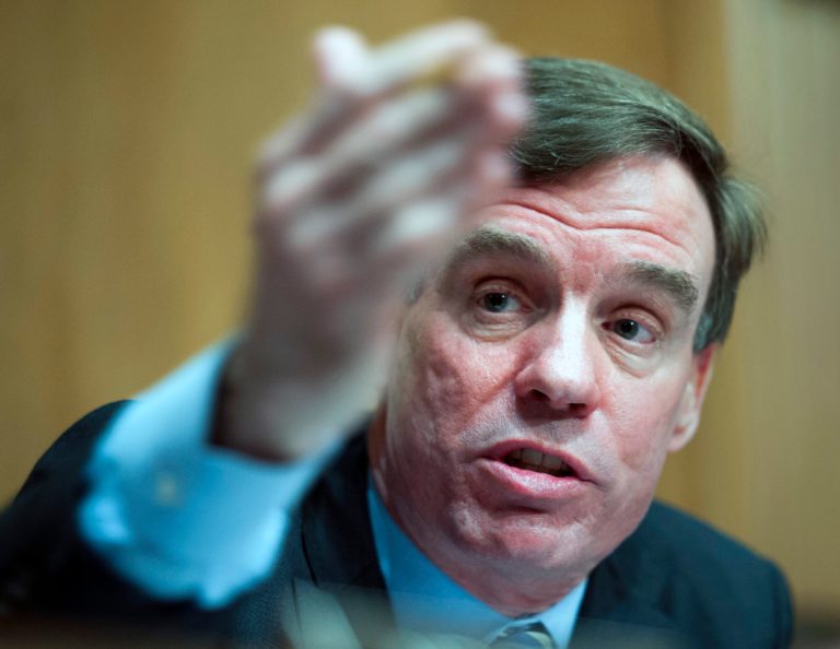 Sen. Mark Warner, D-Va., questions a witness during a committee hearing on March 7 on Capitol Hill in Washington. (AP Photo/Cliff Owen)