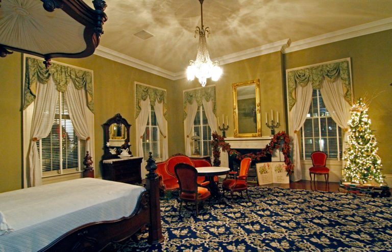   A bedroom in the historical side of the Governor's Mansion is decorated with a Christmas tree, right, and other holiday decorations, Wednesday, Dec. 5, 2012 in Jackson, Miss. The Capitol, the Old Capitol and the Governor's Mansion are among several historic buildings that are decked out with holiday decorations of a particular period style. The buildings are part of an Old Jackson Christmas by Candlelight Tour this Friday, Dec. 7, featuring live music and tours of each building. (AP Photo/Rogelio V. Solis)  