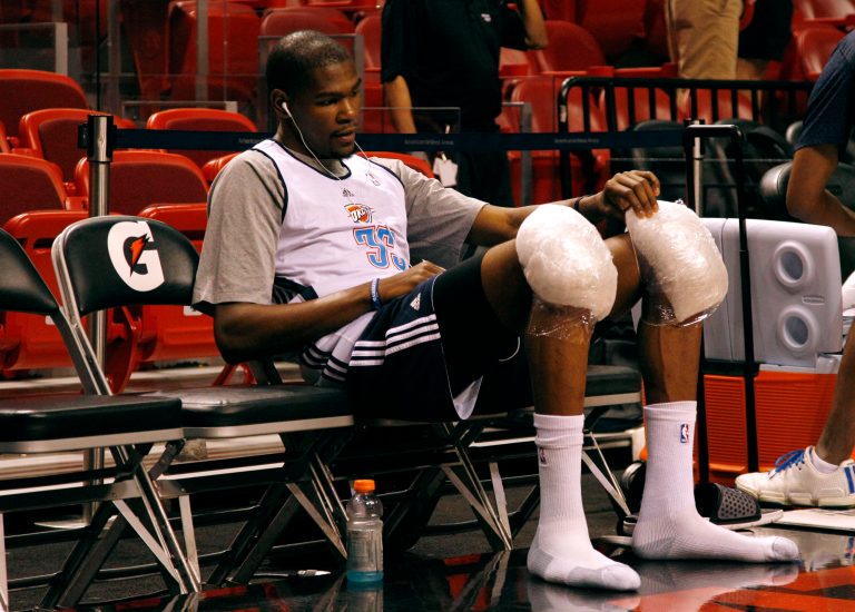   Oklahoma City Thunder's Kevin Durant sits with ice packs on his knees during practice before Game 3 of the NBA finals basketball series against the Miami Heat, Sunday, June 19, 2012, in Miami. (AP Photo/Lynne Sladky)  