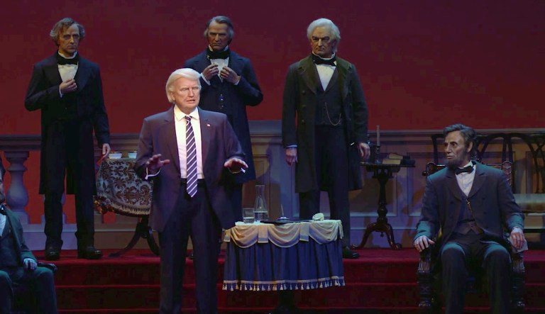 This undated video screen shot provided by Walt Disney World shows an animatronic figure of President Trump, center front, at the Hall of Presidents attraction at Walt Disney World in Orlando, Fla. The Trump figure moves his head during the traditional roll call of leaders, motions with his arms, and gives a brief speech. (Walt Disney World via AP)