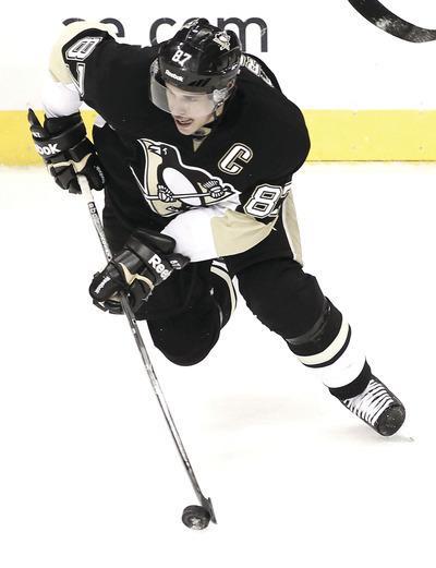 PITTSBURGH, PA-NOVEMBER 21: Sidney Crosby#87 of the Pittsburgh Penguins carries the puck in the second period against the New York Islanders for the first time since sustaining a concussion on January 5 during the game on November 21, 2011 at CONSOL Energy Center in Pittsburgh, Pennsylvania.(Photo by Jared Wickerham/Getty Images)