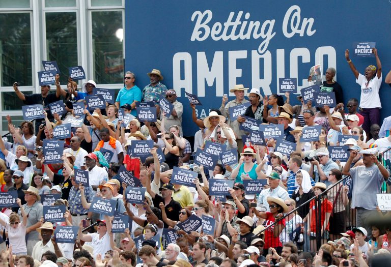 Supporters for President Barack Obama chant and wave signs as he speaks at Carnegie Mellon University on Friday, July 6, 2012, in Pittsburgh, Pa. Obama is on a two-day bus campaign trip through Ohio and Pennsylvania  (AP Photo/Keith Srakocic)