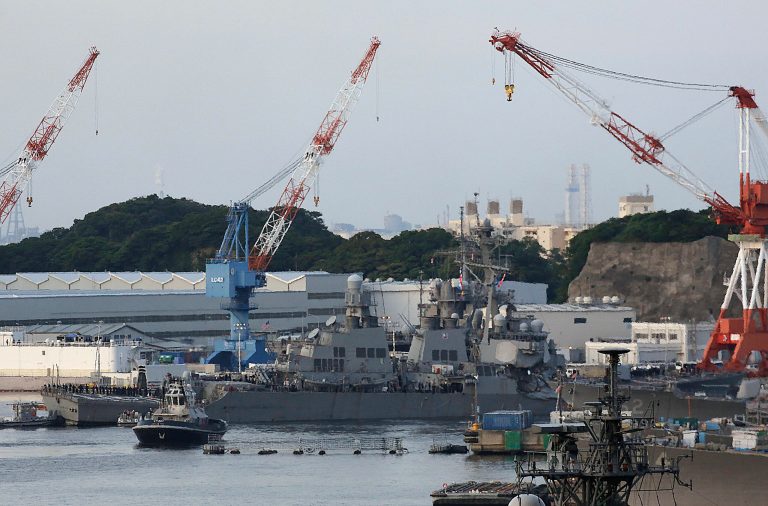 The USS Fitzgerald returned to Yokosuka, Japan about 16 hours after the collision which caused significant damage and flooding. (AP Photo/Eugene Hoshiko)