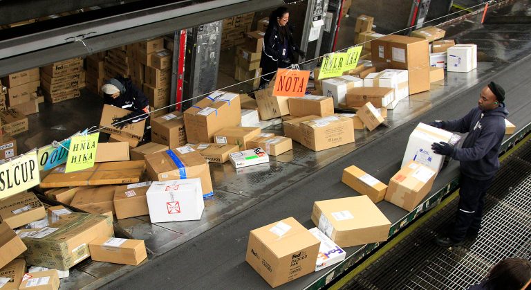   FILE - In this Dec. 11, 2012 file photo, FedEx workers sort packages at the Oakland Regional Sort Facility in Oakland, Calif. A storm bringing heavy winds and snow to much of the Midwest on Thursday, Dec. 20 â the heaviest shipping day of the year â could mean that some packages might not make it under the tree in time for Christmas. (AP Photo/Ben Margot, File)  