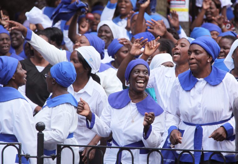   Members of the Anglican Church under the Bishop of Harare, sing and dance in Africa Unity Square during a church service and cleansing ceremony of the church in Harare, Sunday, Dec. 16, 2012, following a court ruling which he won against his rival, excommunicated Bishop Nolbert Kunonga, who forcibly took over church buildings, orphanages, mission schools and hospitals resulting in the court challenge. (AP Photo/Tsvangirayi Mukwazhi)  