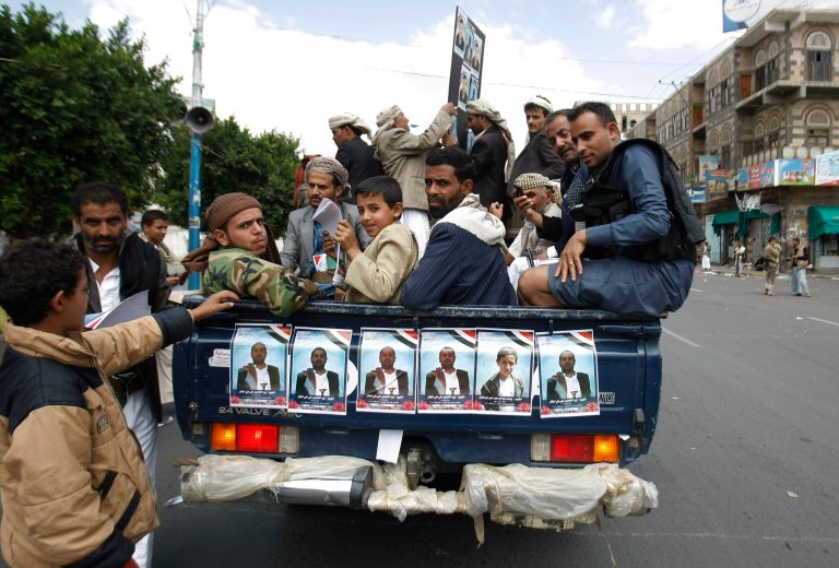 Houthi Shiite Yemenis ride on a pickup truck during funeral of victims who were killed last Thursday by a suicide bomber in central Sanaa, Yemen, Tuesday, Oct. 14, 2014. Two suicide bombings in Yemen killed nearly 70 people last Thursday, with one targeting an anti-government rally by followers of the Houthi Shiite group, who control Sanaa. (AP Photo/Hani Mohammed)