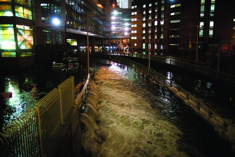 FILE - In this Oct. 29, 2012 file photo, sea water floods the entrance to the Brooklyn Battery Tunnel in New York during Superstorm Sandy. Floodgates for tunnels, subways and airports as well as a network of safe havens like old Civil Defense shelters should be among quick, simple preventive measures that New York installs ahead of future storms, according to the full report by an expert panel examining Superstorm Sandy's effects in the state. (AP Photo/ John Minchillo, File)