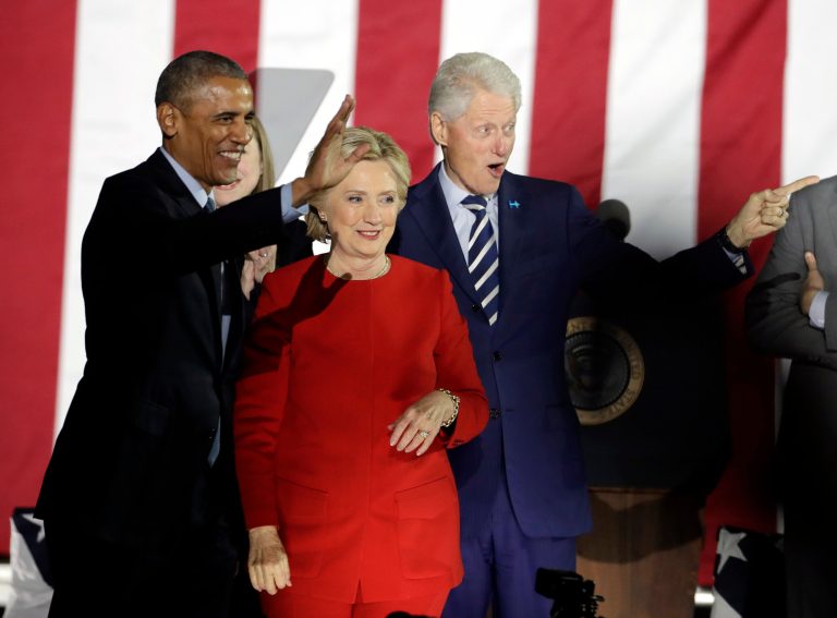 Hillary Clinton claimed Monday evening that her opponent, Donald Trump, wants to take America back to a time where people were free to question the country's founding principles. (AP Photo/Matt Slocum)