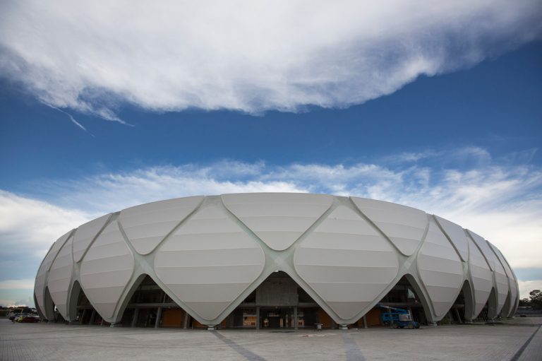 FILE - In this May 20, 2014 file photo, Arena da Amazonia stands in Manaus, Brazil. Once the World Cup leaves town, four gleaming stadiums that hosted massive crowds will echo softly as their owners struggle to find a use for them or even partially fill them. (AP Photo/Felipe Dana, File)