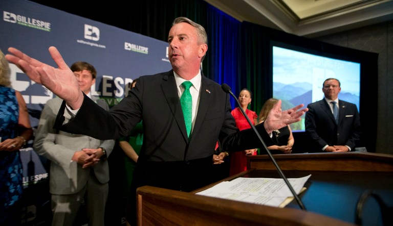 A reporter for progressive media outlet Shareblue was filming Republican gubernatorial candidate Ed Gillespie's car as it arrived at a local Virginia parade when a police officer asked him to stop filming. (AP Photo/Steve Helber)
