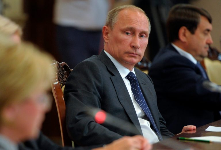 Russian President Vladimir Putin attends a meeting with local officials in Voronezh, Russia, Tuesday, Aug. 5, 2014. Putin says he has ordered the government to develop measures in response to Western sanctions. In a meeting with state officials in the city of Voronezh on Tuesday, did not specify what the measures might be but said: 
