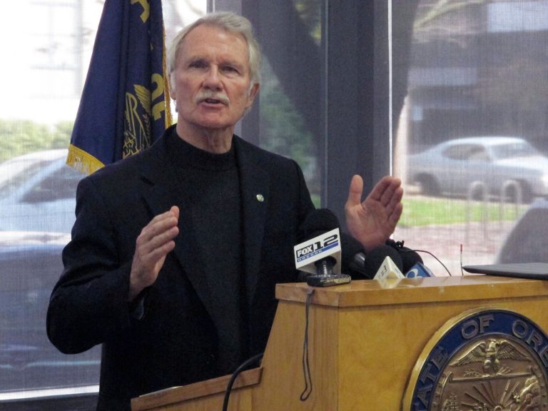Gov. John Kitzhaber discusses problems with the website for Cover Oregon, the state's health insurance exchange, during a news conference on Friday, Nov. 1, 2013 in Portland, Ore. (AP Photo/Jonathan J. Cooper)