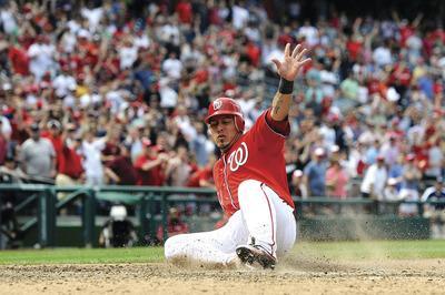 Patrick McDermott/Getty ImagesCatcher Wilson Ramos and the Nationals scored three or fewer runs in eight of their first 14 victories of the season.