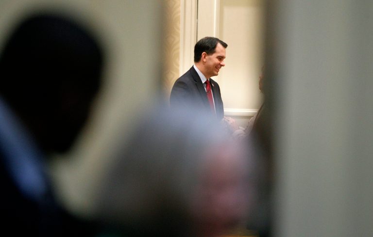 Wisconsin Gov. Scott Walker greets supporters prior to speaking at a luncheon inside the Marriott Hotel in downtown Columbia, S.C. Thursday, March 19, 2015. (AP Photo/The State, Gerry Melendez )
