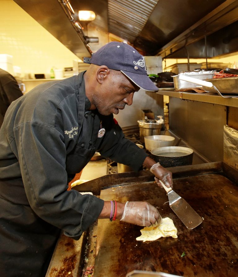 In this Friday, June 6, 2014 photo, executive chef Raymond Nicholson prepares an omelette at Corky & Lenny's Restaurant & Deli in Woodmere Village, Ohio. The Institute for Supply Management, a trade group of purchasing managers, issues its index of non-manufacturing activity for July 2014 on Tuesday, Aug. 5, 2014 (AP Photo/Tony Dejak)