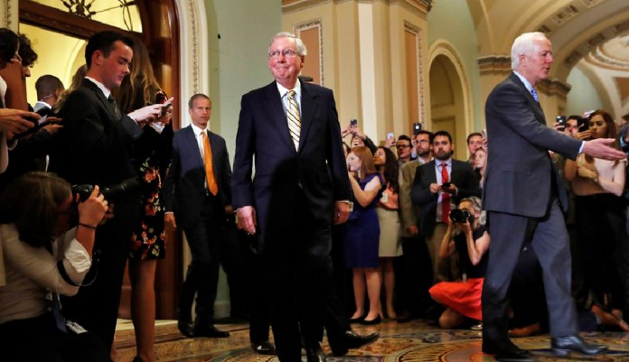 President Trump demanded Sen. Mitch McConnell, R-Ky., "get back to work" Thursday and move forward on his policy agenda following the failed Obamacare vote. (AP Photo/Jacquelyn Martin)