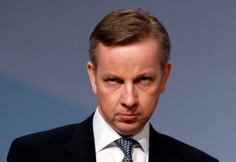FILE - In this Tuesday, Oct. 5, 2010 file photo, Britain's Education Secretary Michael Gove listens to applause after delivering a keynote speech at the Conservative party conference in Birmingham, England. Britain's education minister insists he has not killed a mockingbird, but many literature-lovers don't believe him. Education Secretary Michael Gove has sparked a furor with his campaign to put the basics - and Britishness - back into schools. The latest new rules introduced by his department mean that a major English Literature qualification must focus almost exclusively on writers from the British Isles. Longtime favorites like John Steinbeck's 
