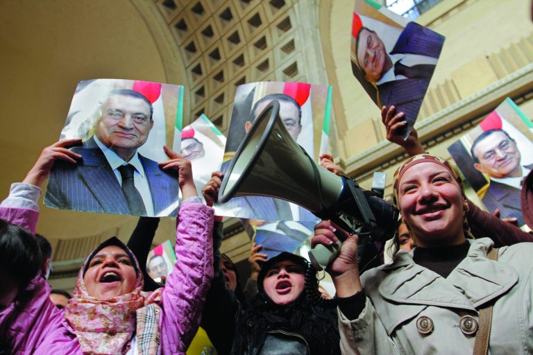 Egyptians supporters of ousted former President Hosni Mubarak celebrate an appeal granted by a court, in Cairo, Egypt, Sunday, Jan. 13, 2013. A court granted Hosni Mubarak's appeal of his life sentence in a Sunday, Jan. 13, 2013 hearing, ordering a retrial of the ousted Egyptian president on charges that he failed to prevent the killing of hundreds of protesters during the uprising that toppled his regime nearly two years ago. The ruling came one day after a prosecutor placed a new detention order on Mubarak over gifts worth millions of Egyptian pounds (hundreds of thousands of US dollars) he and other regime officials allegedly received from Egypt's top newspaper as a show of loyalty while he was in power. (AP Photo/Amr Nabil)