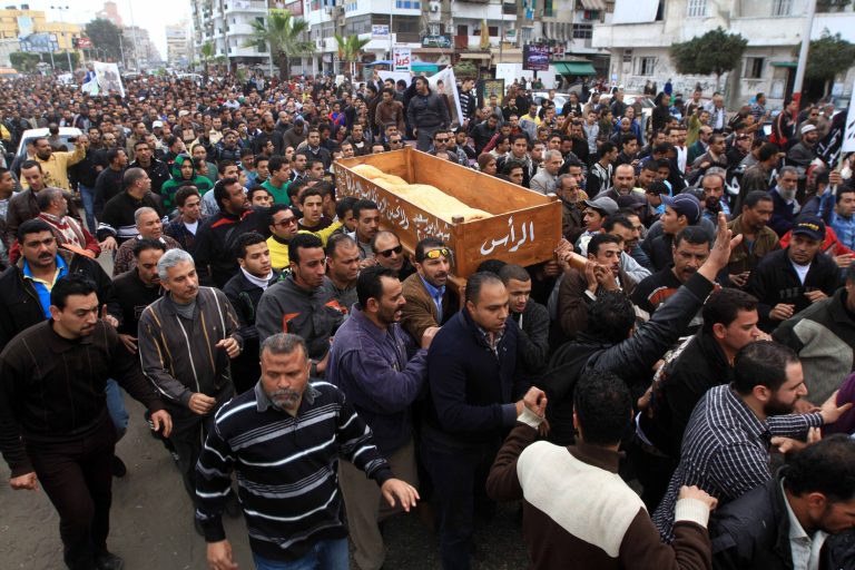 Thousands of residents join a funeral procession for civilians, killed overnight during street battles with security forces, in Port Said, Egypt, Monday, March 4, 2013. The fighting on Sunday prompted the military to intervene to break up the clashes, the first such intervention by the army since the military was deployed in Port Said in late January when tension between protesters and police first erupted. (AP Photo/Ahmed Ramadan)