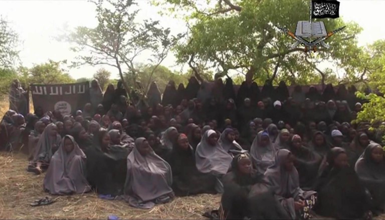 FILE- In this  Monday, May.12, 2014 file image taken from video  by Nigeria's Boko Haram terrorist network, shows the alleged missing girls abducted from the northeastern town of Chibok. Nigerian's Islamic extremists have freed one of the kidnapped Chibok schoolgirls, Nigerian police reported Thursday, Sept. 25, 2014 but a community leader says she's too traumatized to identify herself properly. Hundreds of girls, women and boys have been kidnapped by Boko Haram fighters in the past year but the abduction of more than 270 schoolgirls and young women from a school in the remote northeastern town of Chibok in April inspired a worldwide campaign for their freedom. (AP Photo/File)