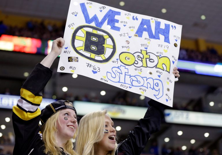 Fans hold up a sign during the second period of an NHL hockey game between the Boston Bruins and the Buffalo Sabres in Boston Wednesday, April 17, 2013. (AP Photo/Elise Amendola)