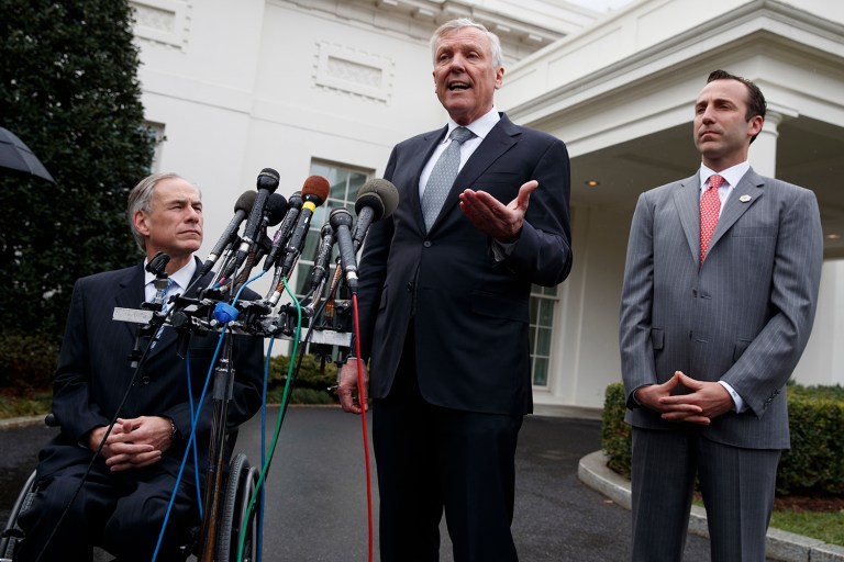 Charter Communications CEO Thomas Rutledge, center, Texas Gov. Greg Abbott, left, and Reed Cordish, Assistant to the President for Intragovernmental and Technology Initiatives, talks to reporters outside the the White House in Washington, Friday, March 24, 2017, after a meeting with President Donald Trump. (AP Photo/Evan Vucci)