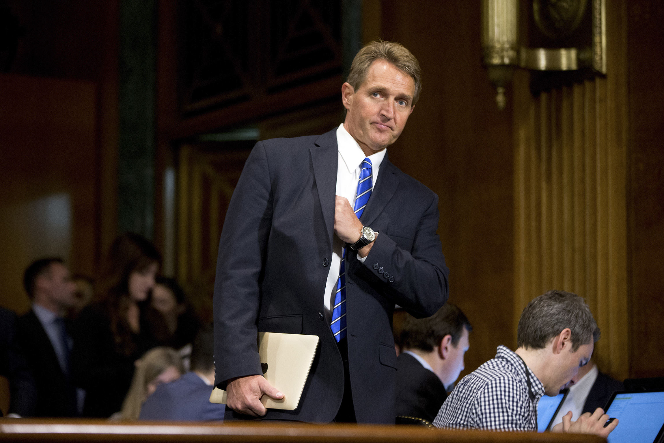 Flake walks out on senior Democrat at hearing
