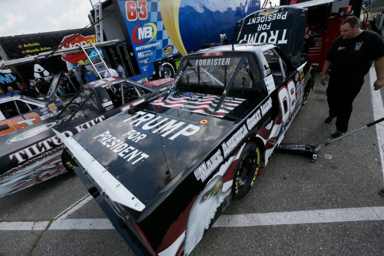 The truck driven by Korbin Forrister is wrapped with a Trump for President before a practice round Friday, Aug. 14, 2015, for the NASCAR Camping World Truck Series auto race at Michigan International Speedway,in Brooklyn, Mich. (AP Photo/Carlos Osorio)