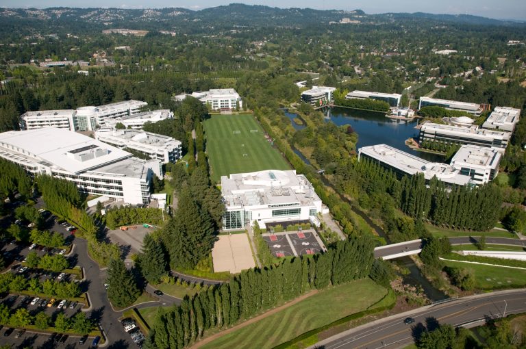   This Aug. 11, 2010 file photo shows the Nike campus from the air. Athletic footwear and apparel giant Nike Inc. plans to expand its operations in Oregon and hire hundreds of workers but wants the government to promise that tax rules won't change, prompting a special session of the Legislature. Gov. John Kitzhaber said he'll call lawmakers together Friday Dec. 14, 2012 in Salem to create a new law authorizing him to grant Nike's wish, and legislative leaders said they'll go along. (AP Photo/The Oregonian, Torsten Kjellstrand)  