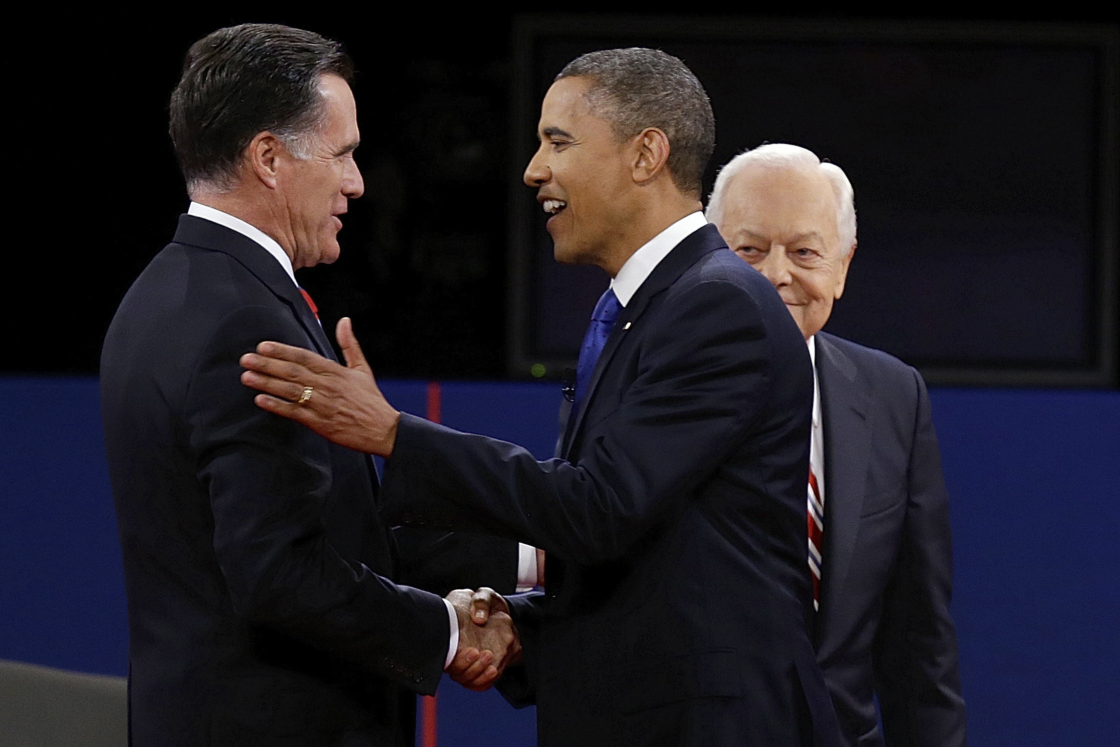 On defensive over health law, Obama turns to Romneycare