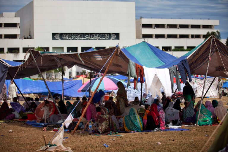Supporters of Muslim cleric Tahir-ul-Qadri camp inside the vicinity of the parliament building in Islamabad, Pakistan, Tuesday, Sept. 2, 2014. Pakistan's lawmakers held an emergency session Tuesday over the political crisis roiling the country as thousands of anti-government protesters remained camped out in front of the parliament building, demanding Prime Minister Nawaz Sharif resign. (AP Photo/B.K. Bangash)